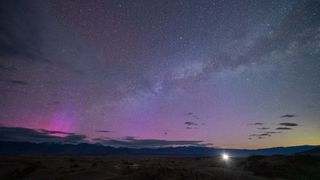 Purple aurora glow seen above the horizon from California's Death Valley.