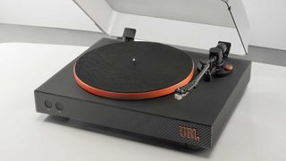 JBL Spinner BT on a tabletop with its lid open