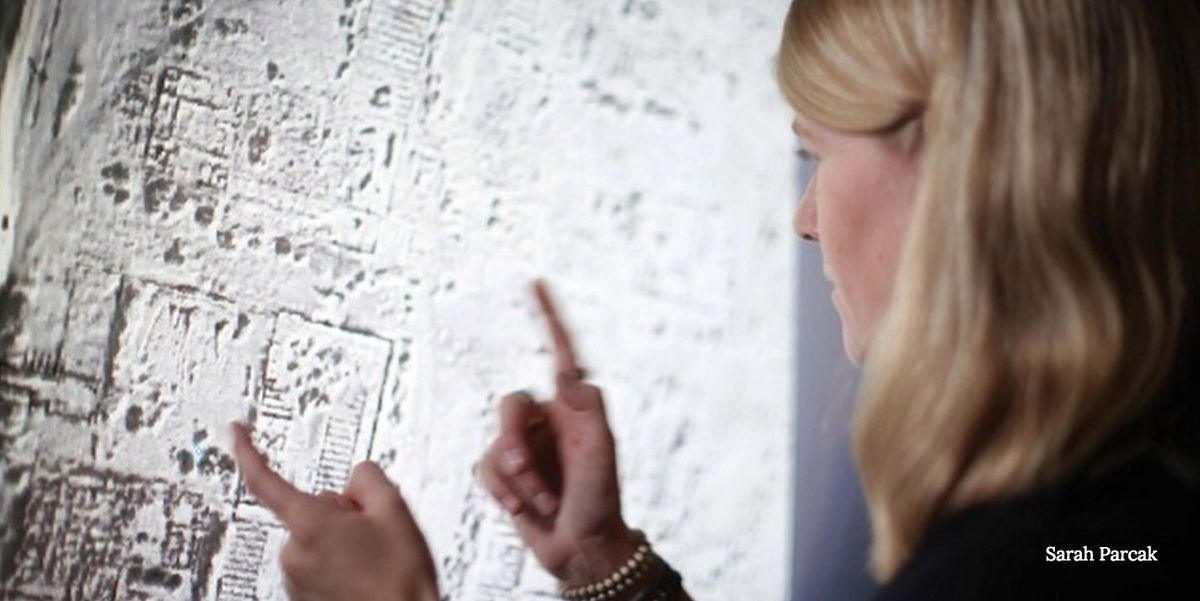 Space archaeologist Sarah Parcak examines a satellite image.