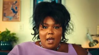 Lizzo waking up after s night of superhero activity in "Special" music video
