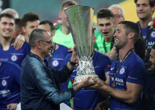 There has been continued speculation over Sarri's (left) future
