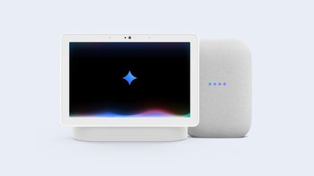 A smart display and smart speaker with the Google gemini glyph in the center of the display
