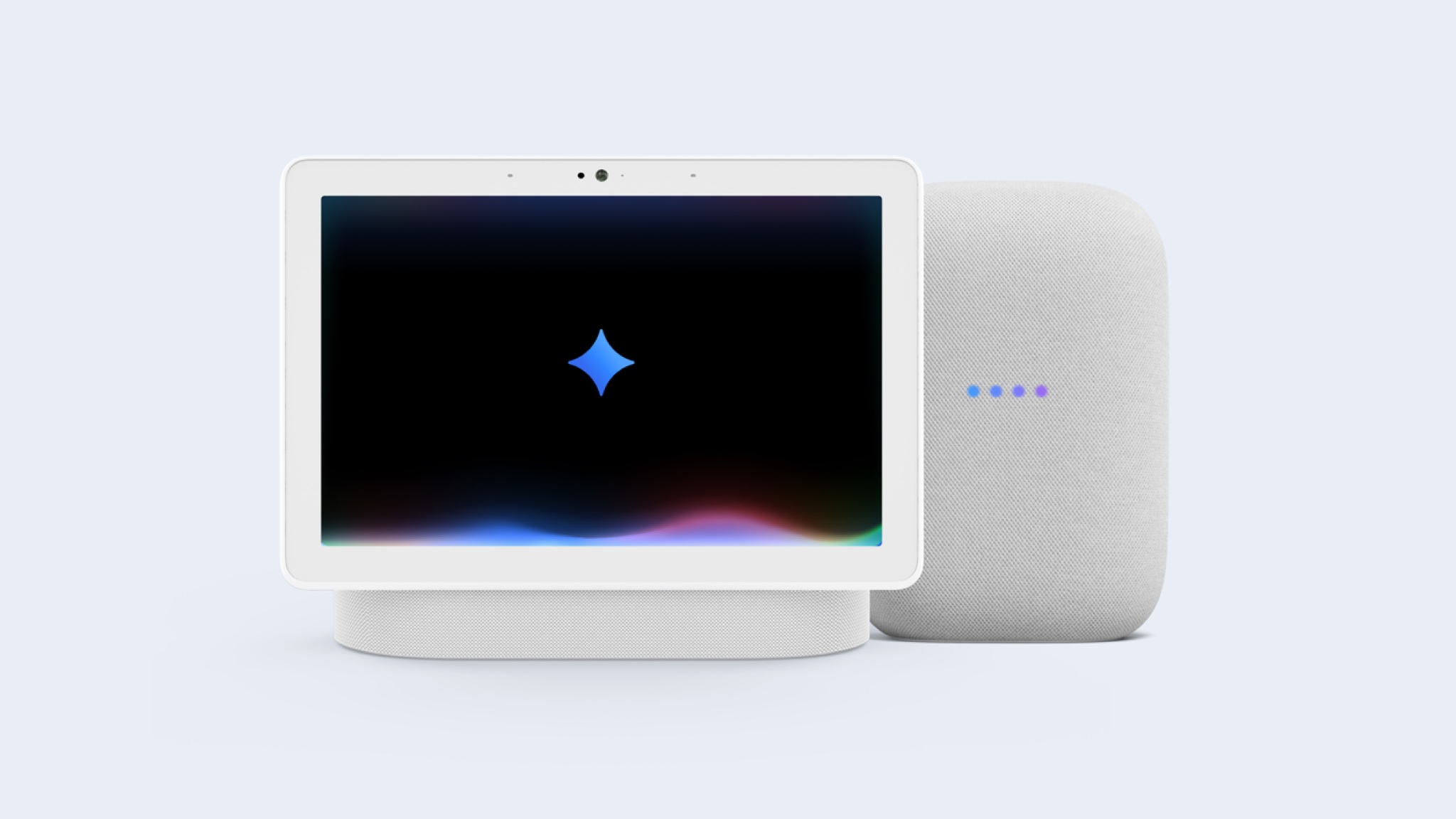 A smart display and smart speaker with the Google gemini glyph in the center of the display