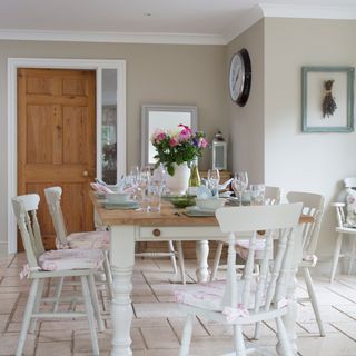 dining room with dining table chairs and tableware