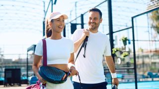 people holding racket ball rackets