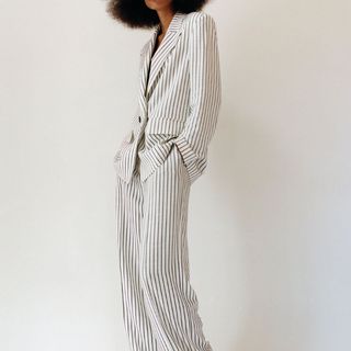 model wearing Zara White Striped Blazer and trousers