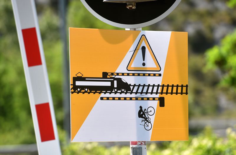 A warning for the riders who might think of riding over the train tracks