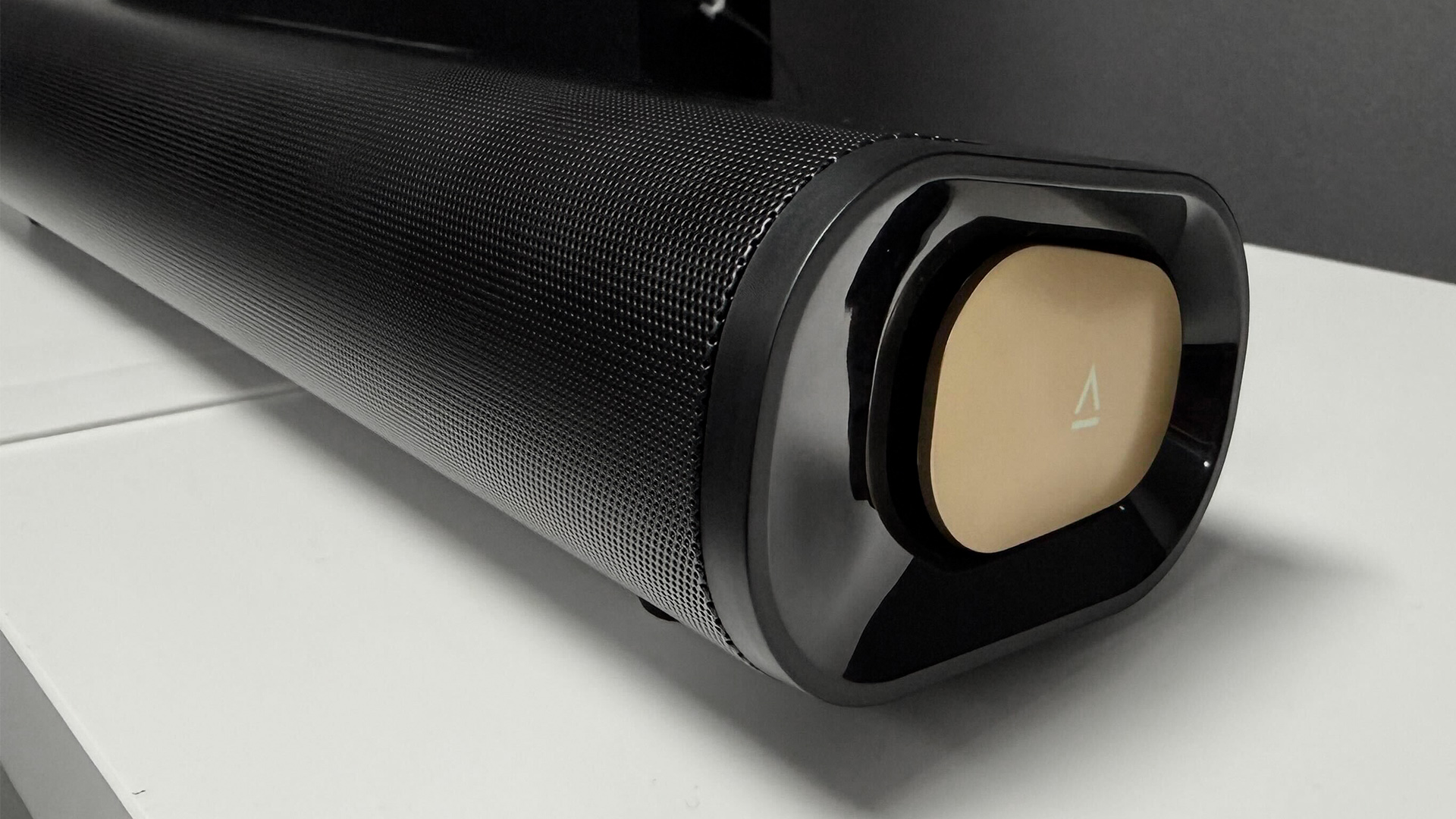 Creative Stage Pro soundbar on white surface detail of end of soundbar