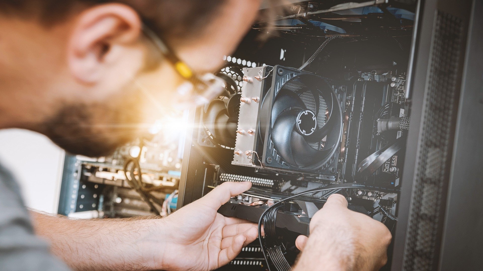 A person looking inside a PC