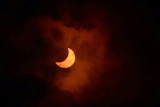 Astronomer Jay Pasachoff of Williams College took this photo of the first solar eclipse of 2014 through clouds on April 29, 2014 while observing from Albany, Western Australia, where a partial eclipse was visible.