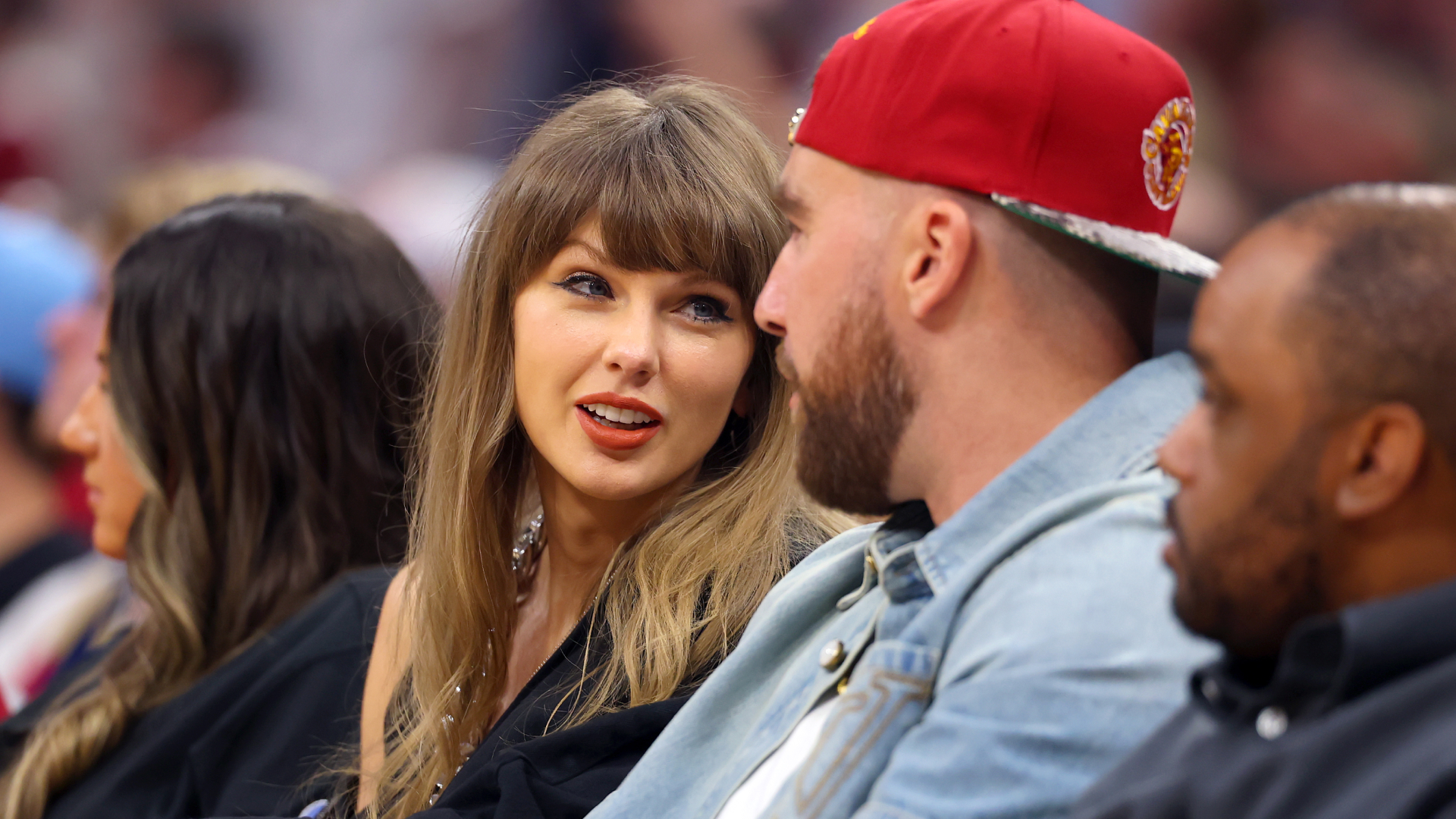 Taylor Swift and Travis Kelce attend Game 3 of the NBA Eastern Conference Finals wearing matching denim outfits