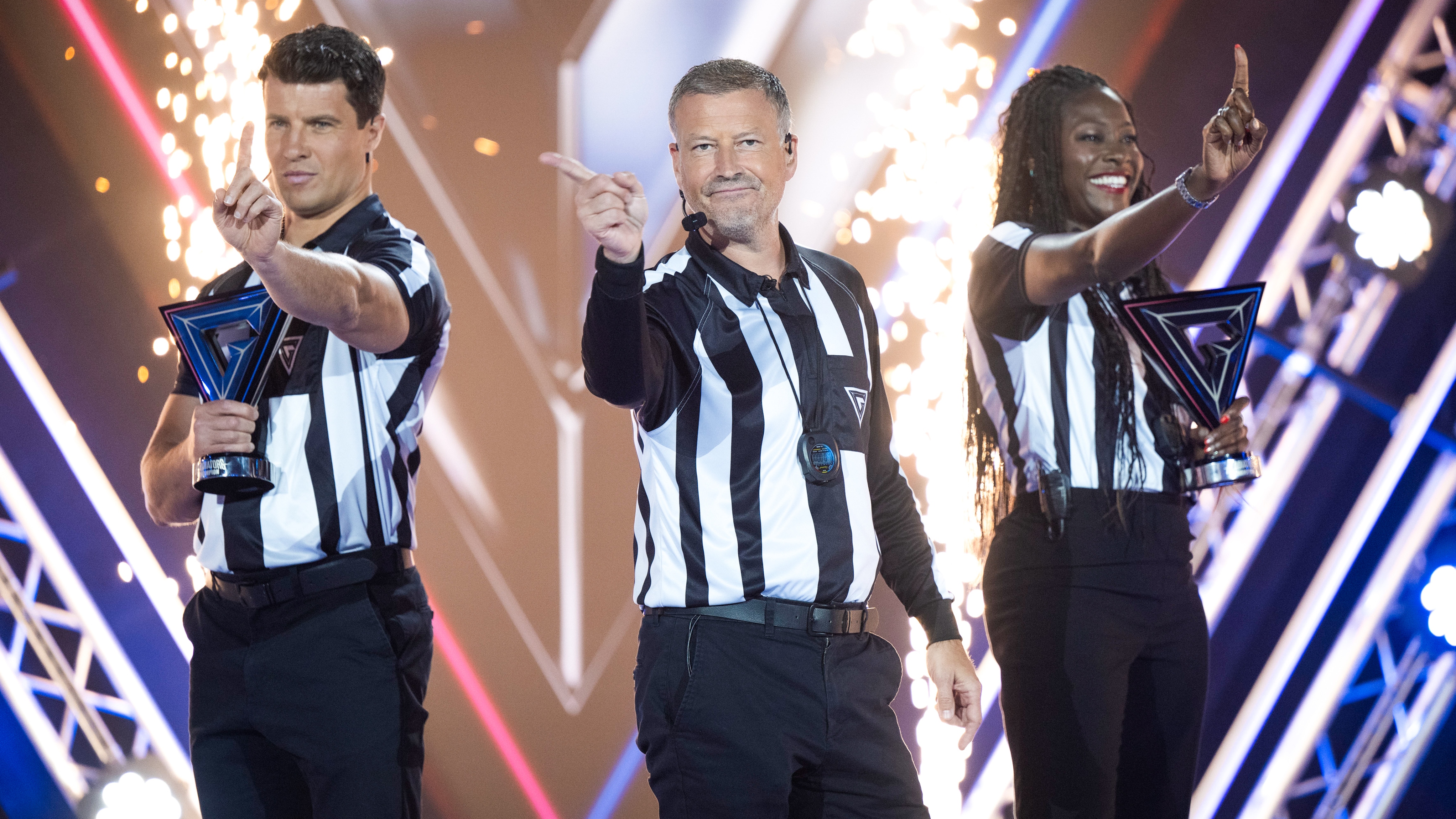 Lee Phillips, Mark Clattenburg, Sonia Mkoloma in stripy black and white tops
