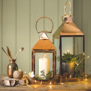 christmas lanterns and candles with fairy lights