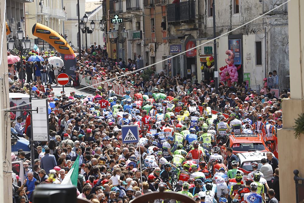 The crowds of people lining the streets to see the peloton
