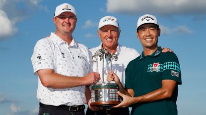 Jason Kokrak, Greg Norman and Kevin Na pose with the trophy after the 2021 QBE Shootout
