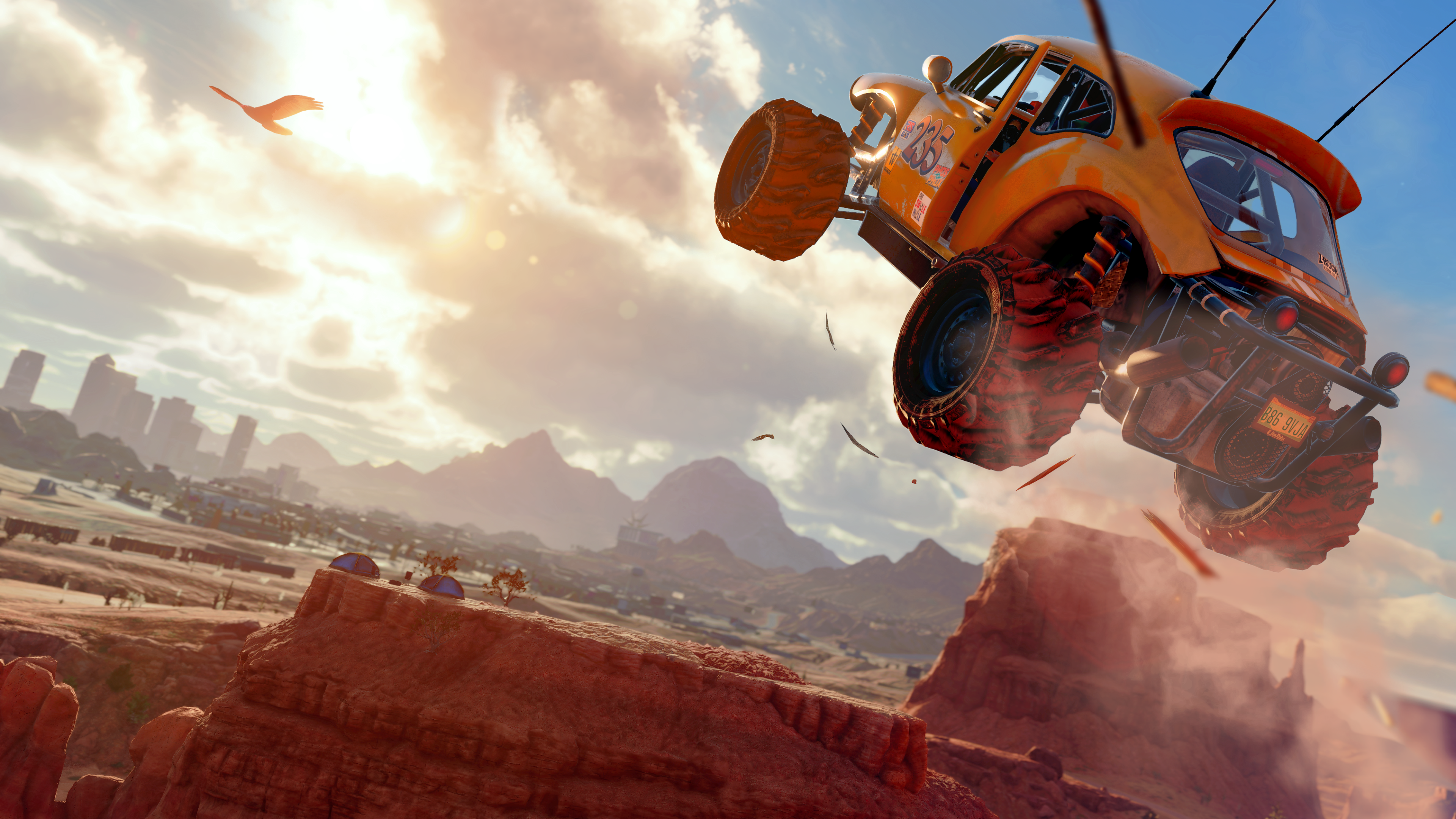 Saints Row reboot screenshot showing an off-road vehicle flying through the air in a desert canyon setting
