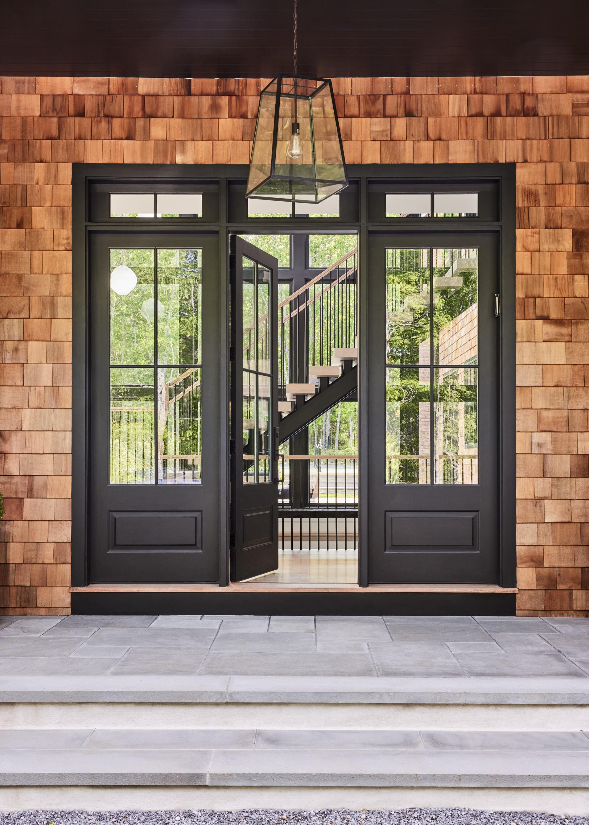 A front doorway leading to a staircase within