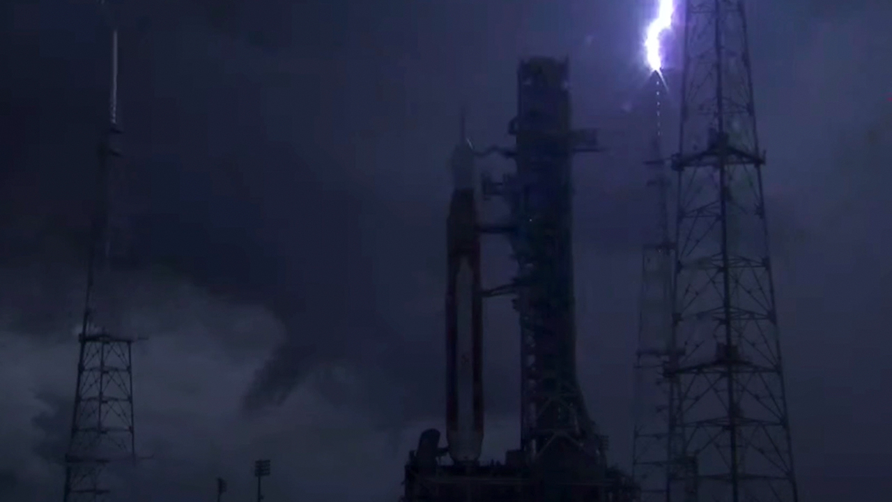 Lightning strikes one of the lightning towers at Pad 39B at Kennedy's Space Center in Florida on Aug. 27, 2022. NASA's Artemis 1 moon rocket is on the pad, awaiting a planned Aug. 29 launch.