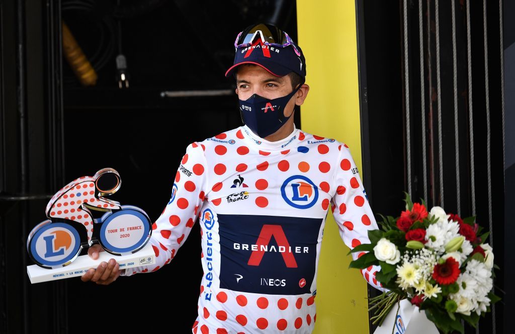 Team Ineos rider Ecuadors Richard Carapaz celebrates his best climbers polka dot jersey on the podium at the end of the 18th stage of the 107th edition of the Tour de France cycling race 168 km between Meribel and La Roche sur Foron on September 17 2020 Photo by AnneChristine POUJOULAT POOL AFP Photo by ANNECHRISTINE POUJOULATPOOLAFP via Getty Images