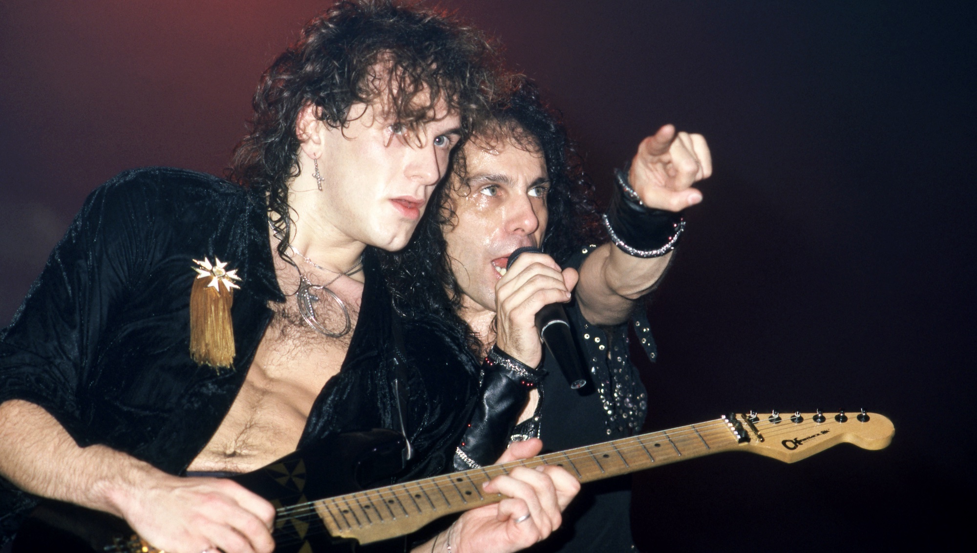 Vivian Campbell (left) and Ronnie James Dio perform onstage at the Cobo Arena in Detroit, Michigan on November 2, 1985