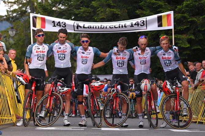 Lotto Soudal line across the finish line of stage 4 for a moment of silence in memory of their teammate Bjorg Lambrecht at the Tour de Pologne