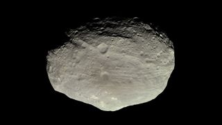 a large gray rocky body is set against the blackness of space.