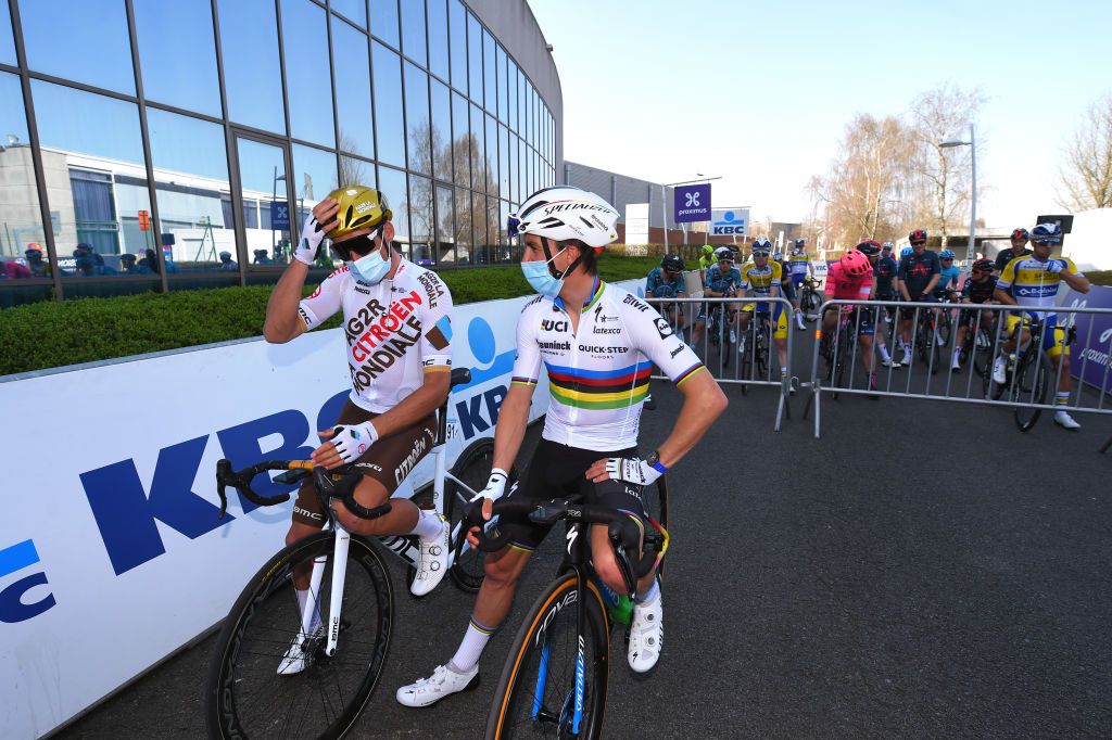 WAREGEM BELGIUM MARCH 31 Start Greg Van Avermaet of Belgium and Team AG2R Citren Team Julian Alaphilippe of France and Team Deceuninck QuickStepduring the 75th Dwars Door Vlaanderen 2021 Mens Elite a 1841km race from Roeselare to Waregem DDV DDV21 FlandersClassic A travers la Flandre on March 31 2021 in Waregem Belgium Photo by Luc ClaessenGetty Images