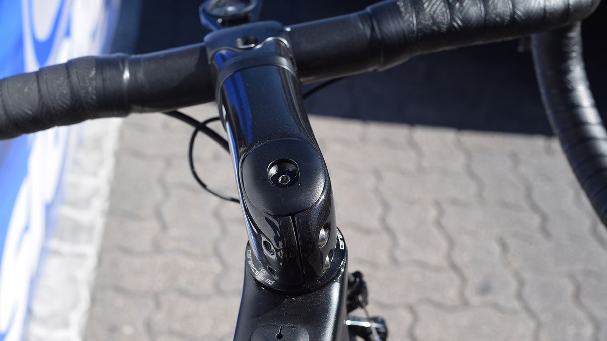 The top cap accommodates the shim adjustment with its squarish shape