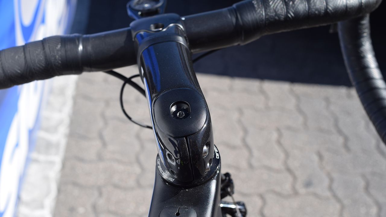 The top cap accommodates the shim adjustment with its squarish shape