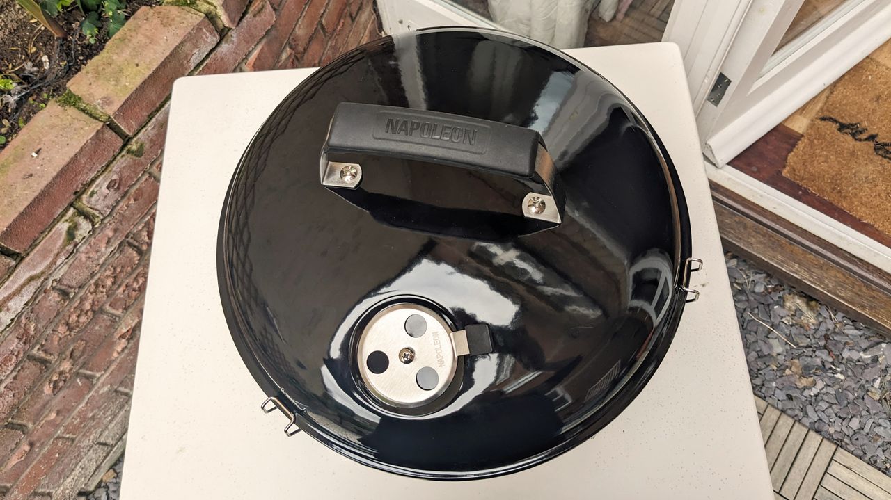 Napoleon NK14 Portable Charcoal Kettle Grill being tested in writer's home