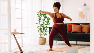 Woman doing yoga exercise at home