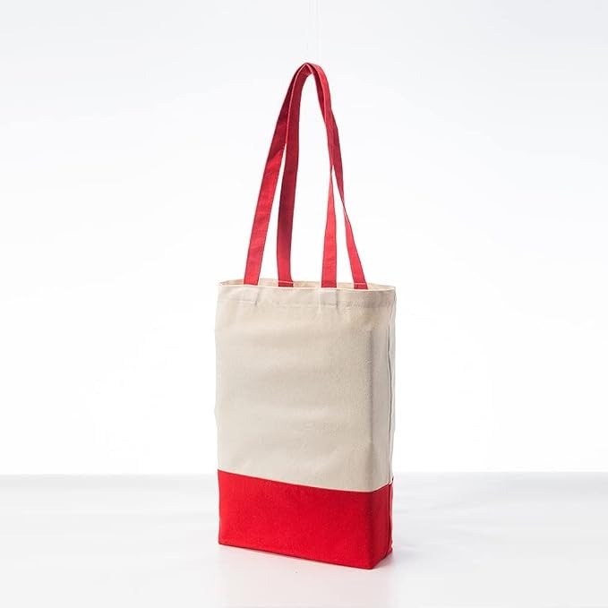 beige canvas tote bag with red stripe at the bottom and red handles