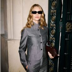 An image of Rosie Huntington-Whiteley wearing the grey and burgundy outfit trend. 