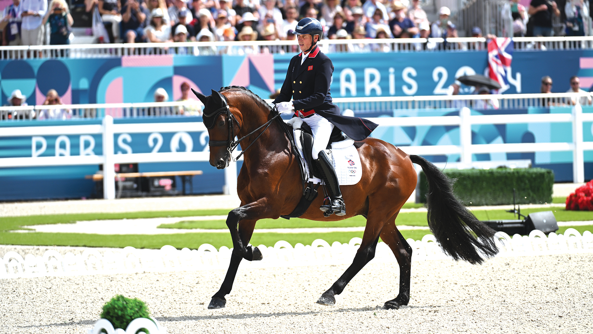 Carl Hester rides Fame in left canter in the Paris 2024 Olympics dressage arena