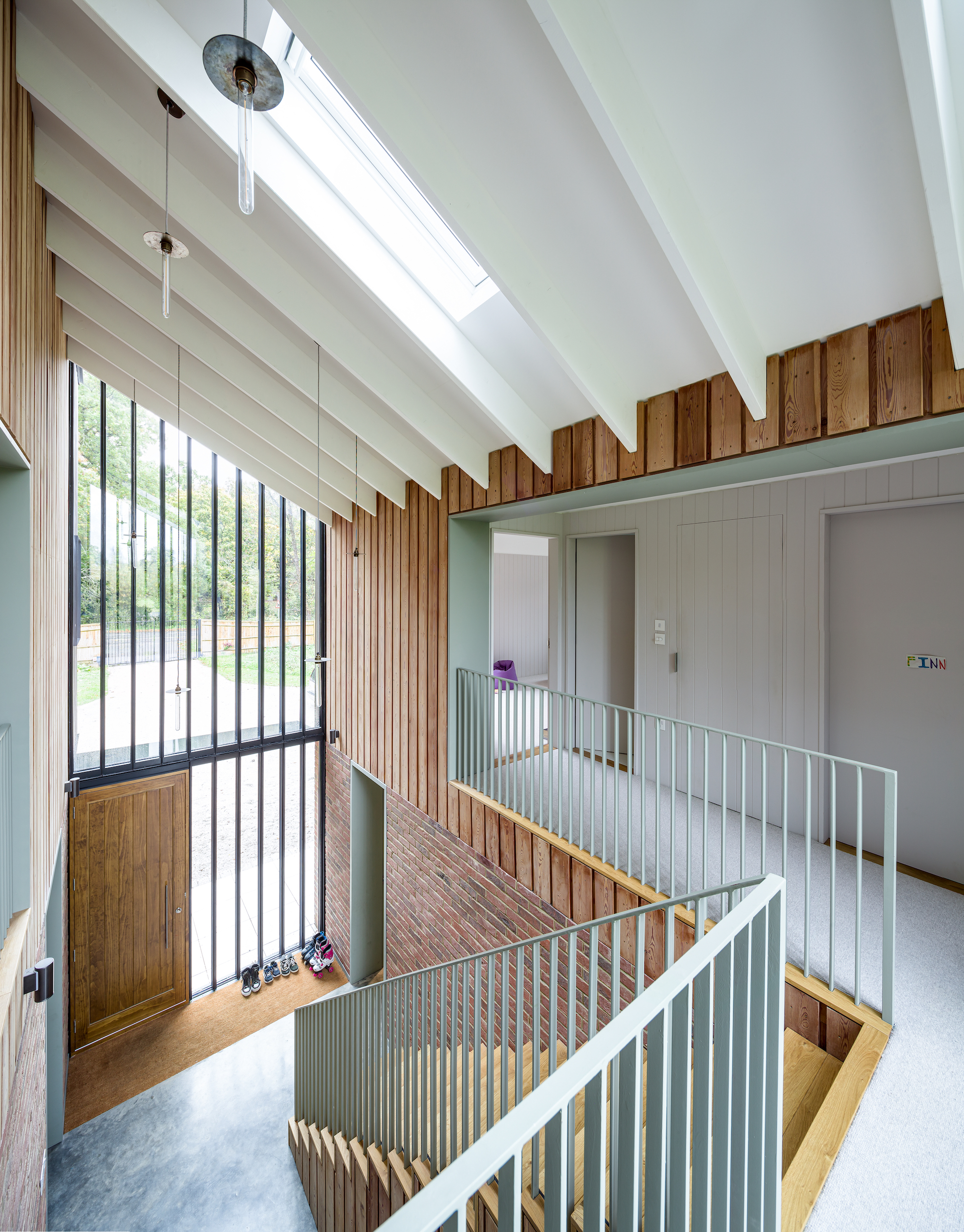 glazed hallway atrium with timber cladding