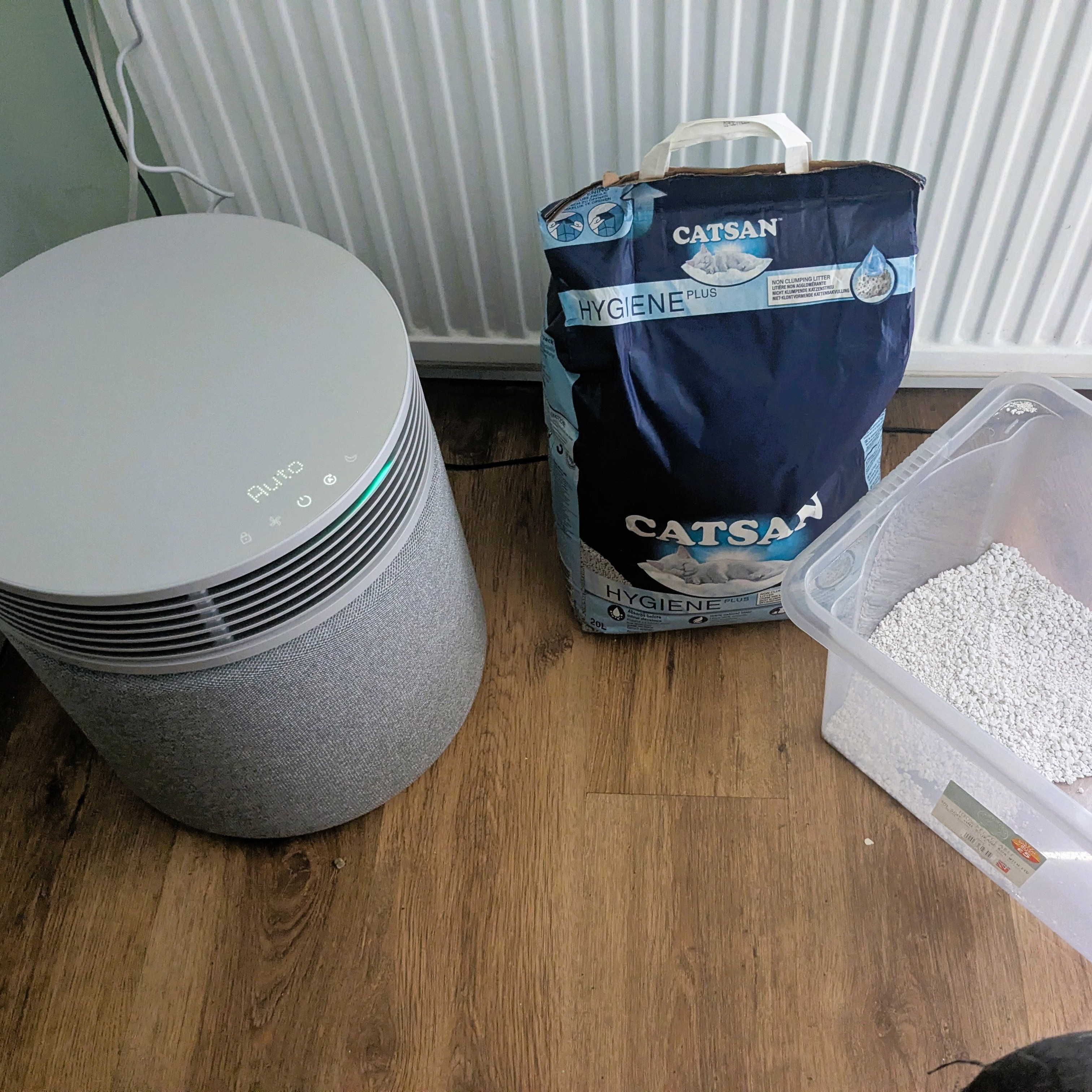 Blueair Blue Signature pictured next to large bag of cat litter