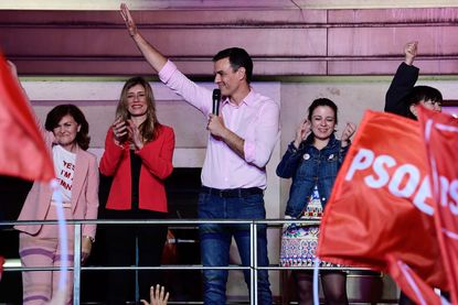 Pedro Sanchez, of Spain's Socialist Party, celebrates his re-election