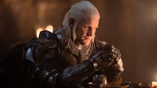 Matt Smith as Daemon Targaryen in Season 2 of House of the Dragon sitting and wearing armor. 
