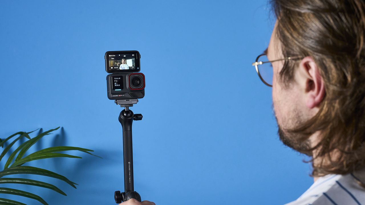 The Insta360 Ace Pro 2 against a blue background