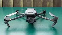 The DJI Mavic 3 drone sitting on a green surface