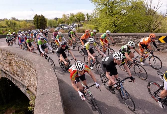 The peloton navigate their way over a bridge in Kealkill, Cork during Stage 5 of the An Post Ras