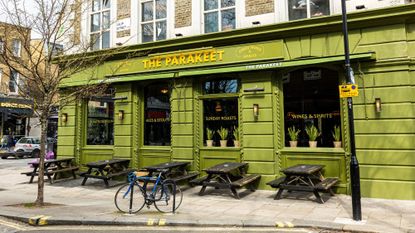 The restaurant's impressive stained glass and open kitchen 