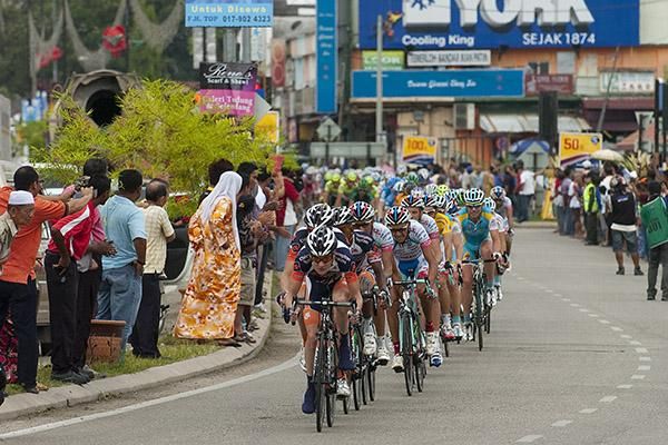 The peloton head through a sprint point trying to bridge a gap to a leading group around three minutes up the road.