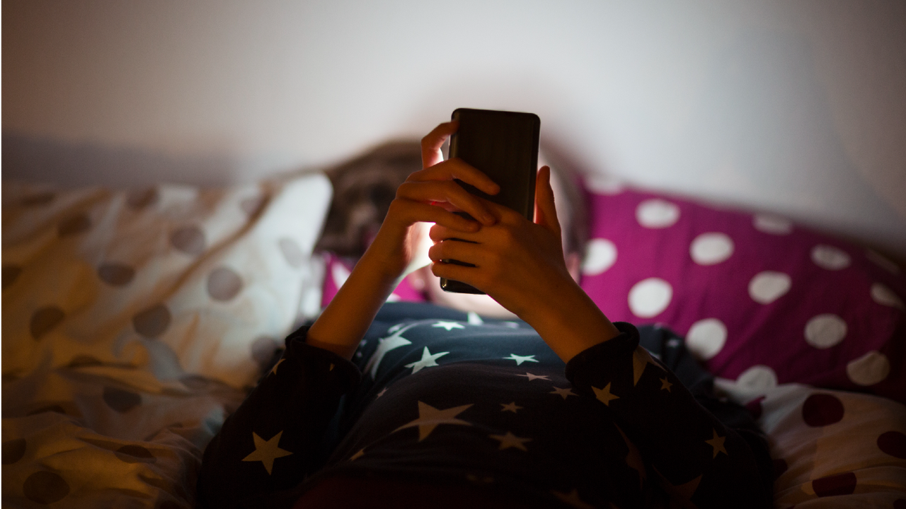 Stock photo of young girl on her phone