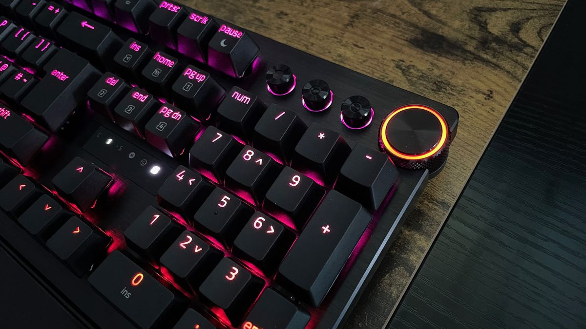 A closeup of the Razer Huntsman V3 Pro keys and the audio control buttons and multi-function digital dial.