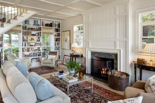 home library with living room fireplace in maine