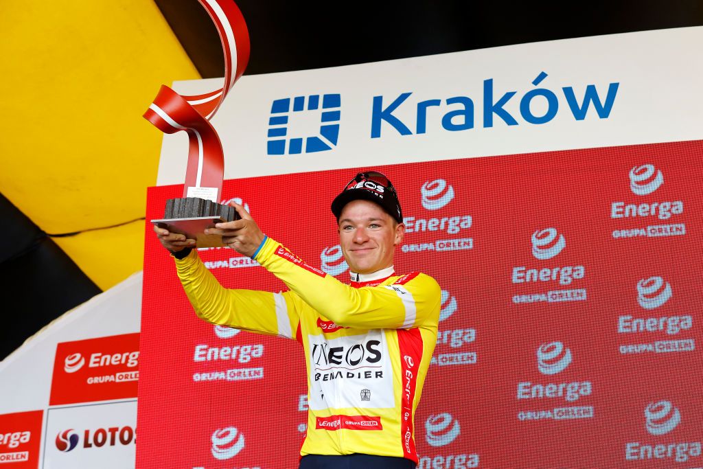 KRAKOW POLAND AUGUST 05 Ethan Hayter of United Kingdom and Team INEOS Grenadiers celebrates winning the Yellow Leader Jersey on the podium ceremony after the 79th Tour de Pologne 2022 Stage 7 a 1778km stage from Valsir to Krakow TdP22 WorldTour on August 05 2022 in Krakow Poland Photo by Bas CzerwinskiGetty Images