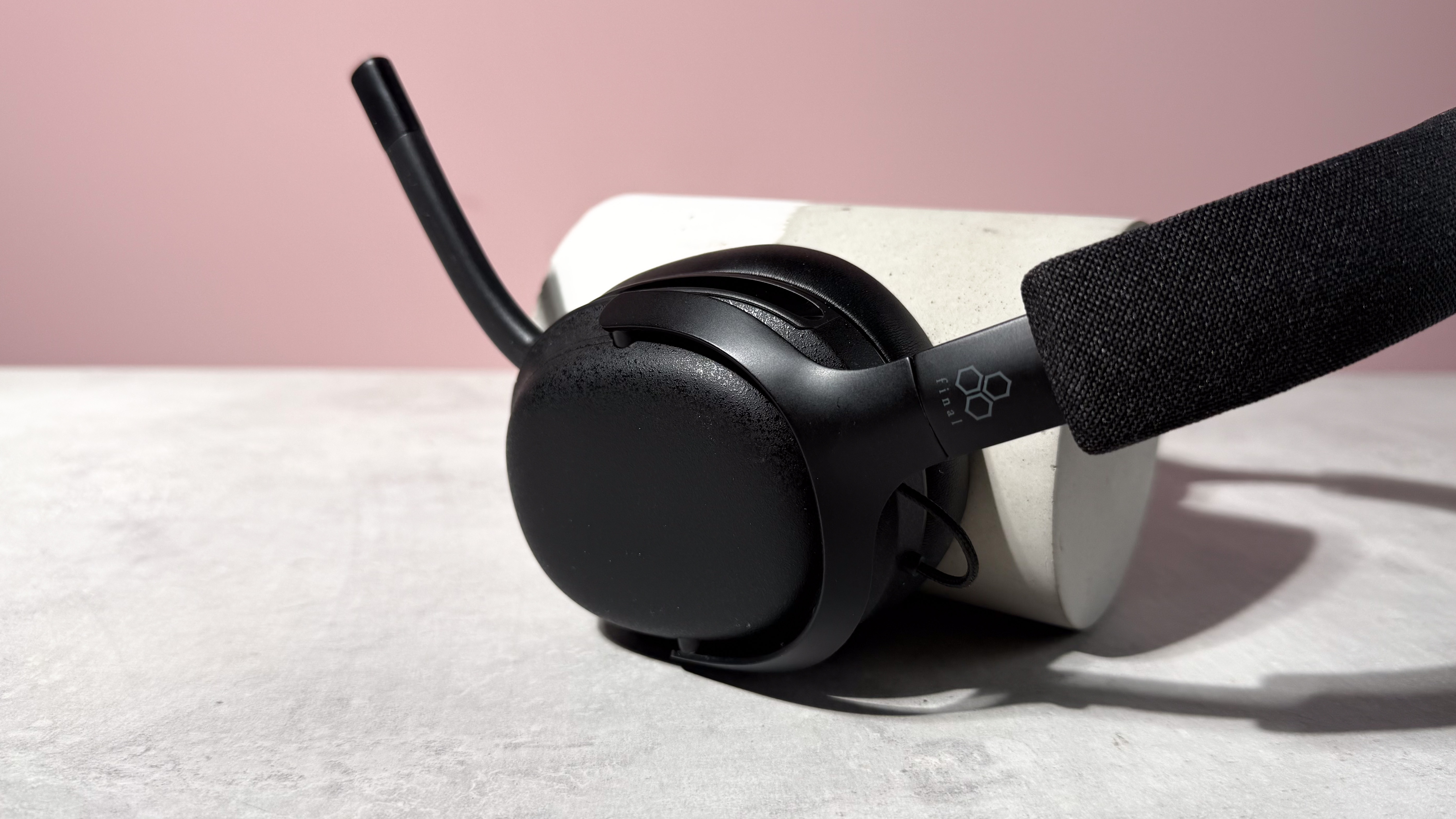 A closeup of the Final VR3000 EX for Gaming's left earcup with the mic unfolded.