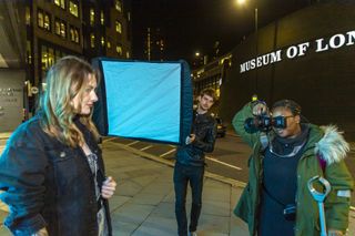 Alastair holds his flashgun with a Lastolite Ezybox 90cm attached to fire it off camera to light one side of the model