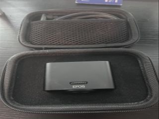 The EPOS EXPAND Vision 1 in its carrying case.